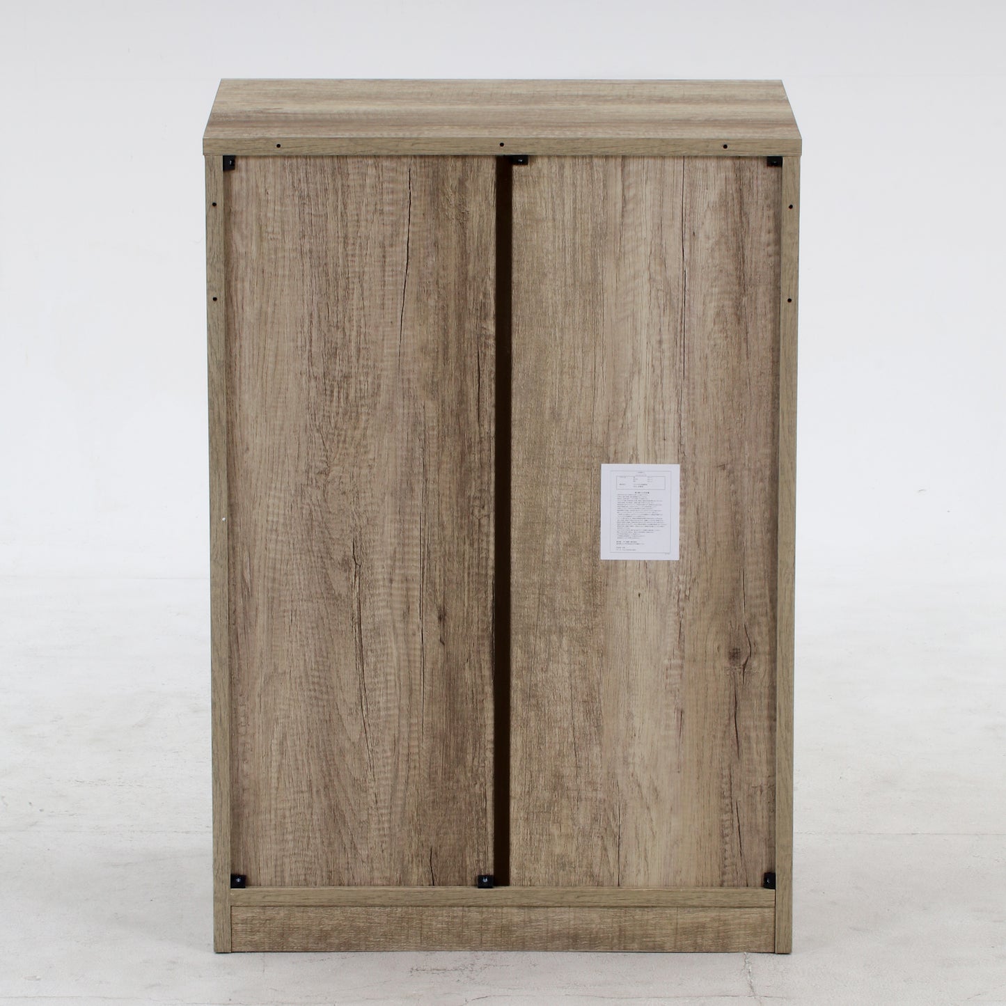 ユニット収納3段チェストグレーを背面からうつした様子