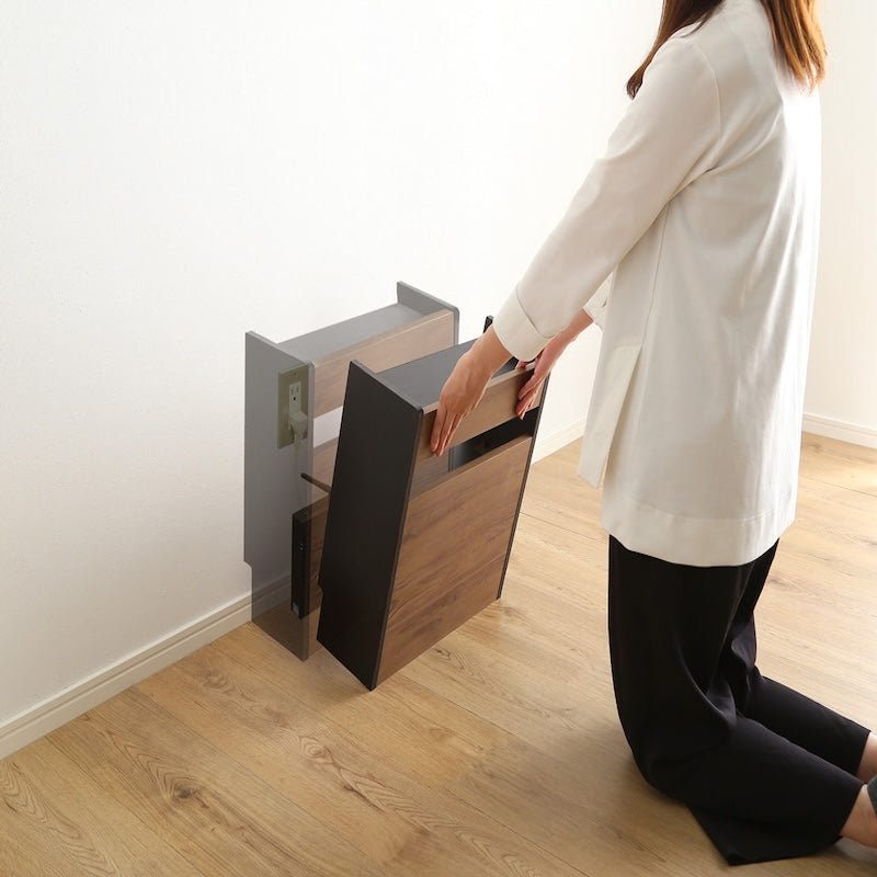 ケーブルボックスをコンセント付近に置いている様子