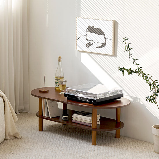 Dark wood oval coffee table with two shelves and four legs by roomnhome for layered living room storage