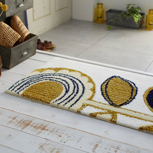 玄関に敷いてあるひまわりをモチーフにした温かみのあるデザインのミニラグ