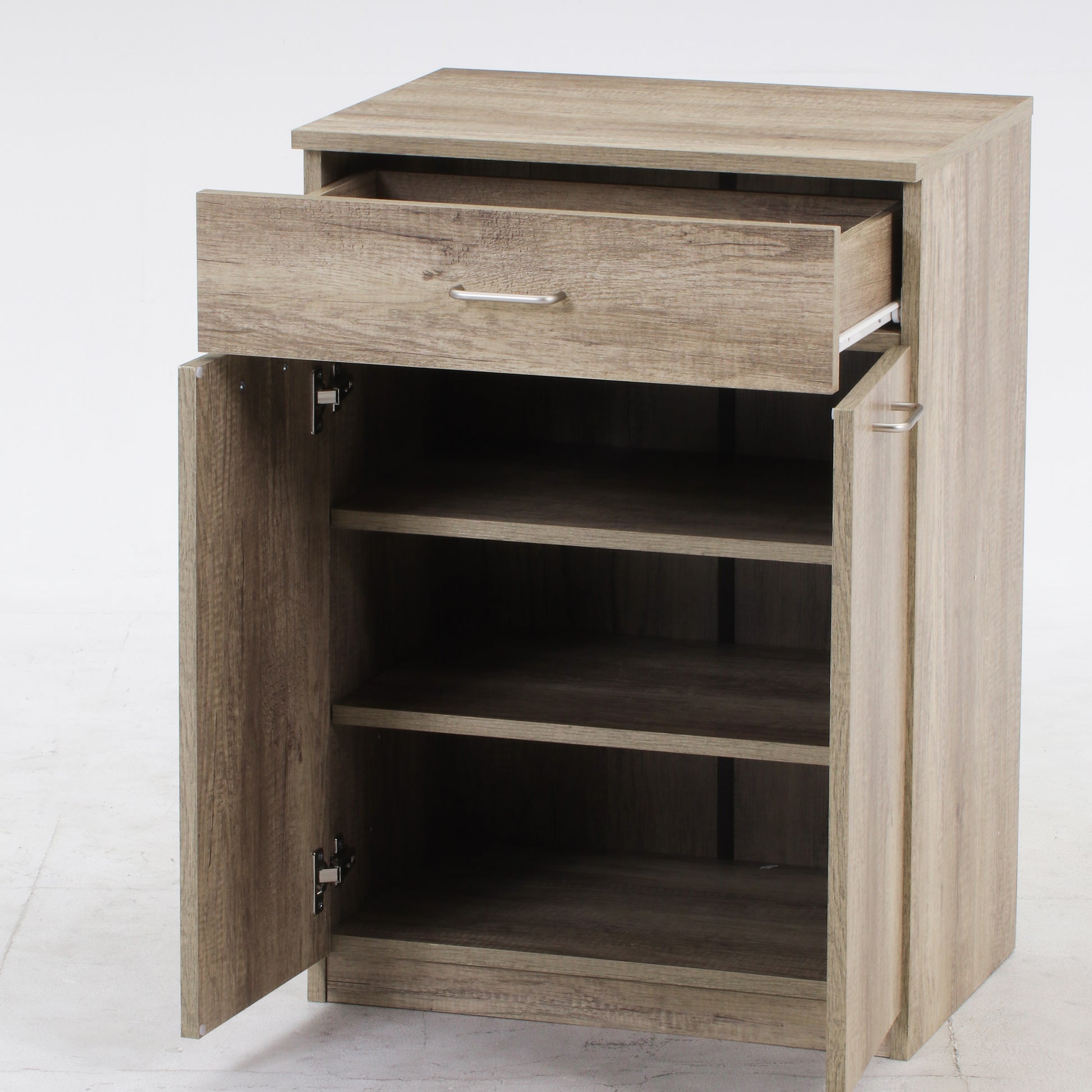 ユニット収納キャビネットグレーの引き出し全て開いた状態をうつしている様子