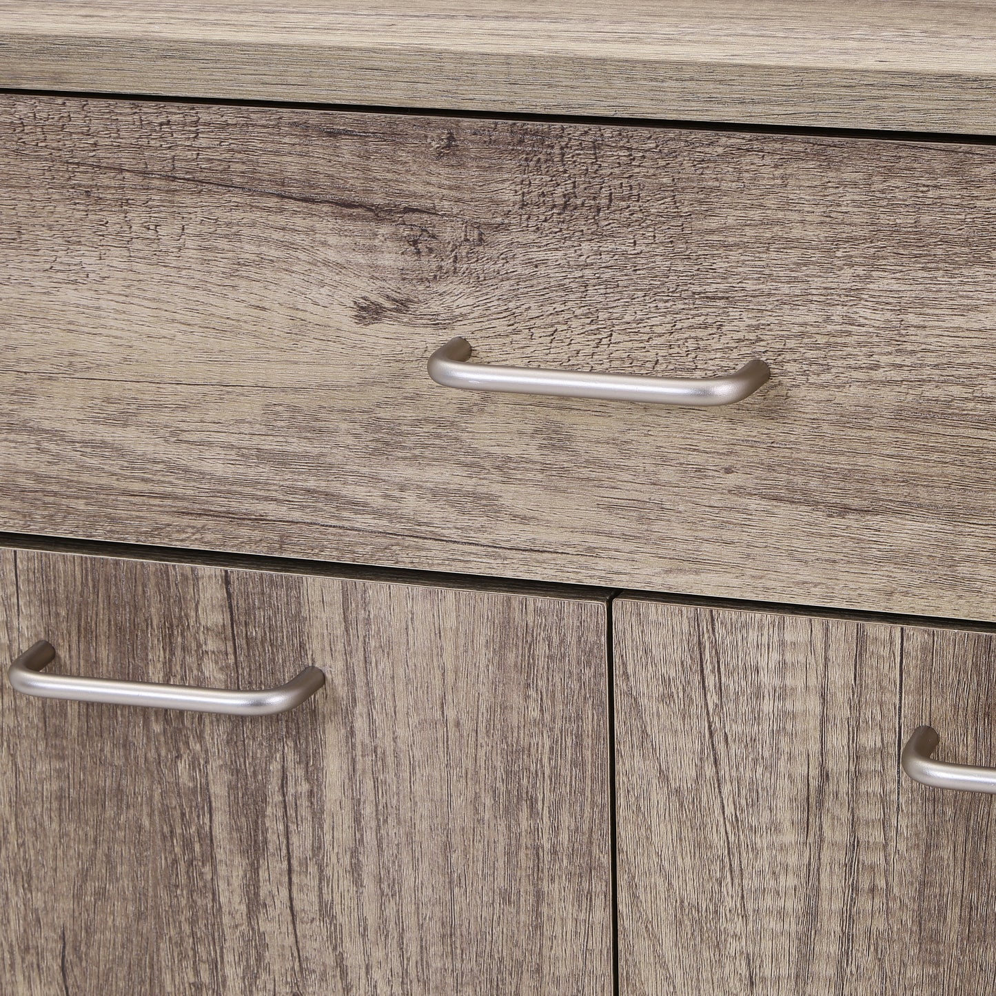 ユニット収納キャビネットグレーの引き出し取手部分をうつしている様子