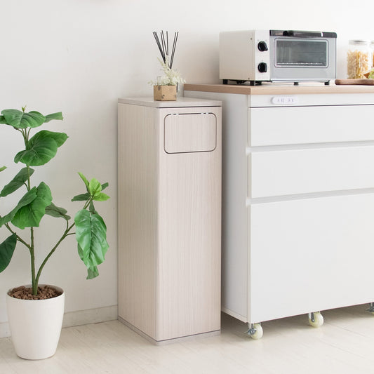 白の家具調のデザインで空間にすっとなじむプッシュ扉式のダストボックスが置いてある空間