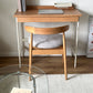 Light wood desk with white metal legs and matching wooden マーシュダイニングチェア with gray upholstered seat